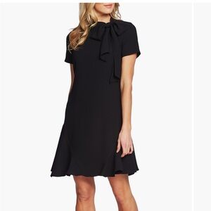 Chic Black Mini Dress with Lace Detail and Flared Skirt